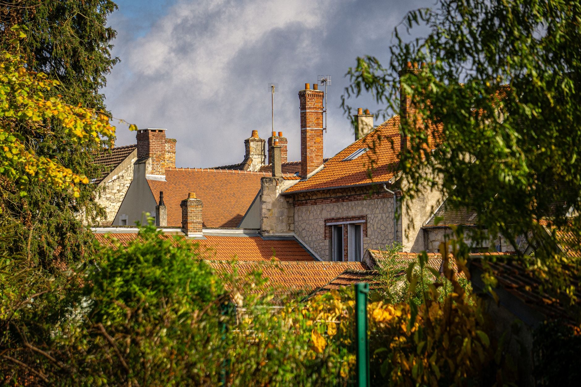 A family with children tours a new house guided by a realtor. Ideal for real estate themes.